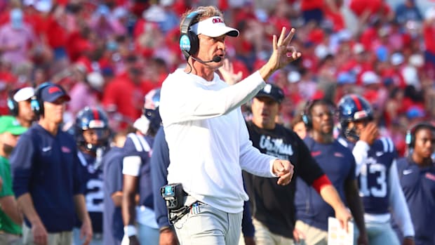 Lane Kiffin gestures on the sideline during an Ole Miss game.
