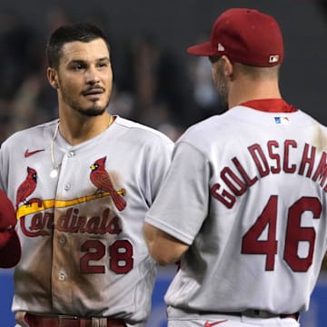 Aug 19, 2022; Phoenix, Arizona, USA; St. Louis Cardinals third baseman Nolan Arenado (28) talks to first baseman Paul Goldschmidt (46) in between innings against the Arizona Diamondbacks at Chase Field. Mandatory Credit: Rick Scuteri-Imagn Images