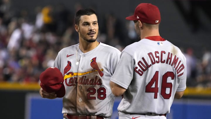 Aug 19, 2022; Phoenix, Arizona, USA; St. Louis Cardinals third baseman Nolan Arenado (28) talks to first baseman Paul Goldschmidt (46) in between innings against the Arizona Diamondbacks at Chase Field. Mandatory Credit: Rick Scuteri-Imagn Images