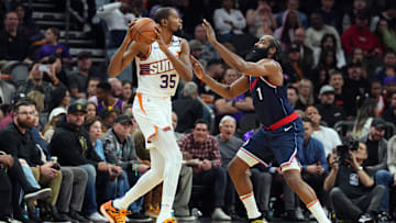 Jan 27, 2025; Phoenix, Arizona, USA; LA Clippers guard James Harden (1) guards Phoenix Suns forward Kevin Durant (35) during the second half at Footprint Center. Mandatory Credit: Joe Camporeale-Imagn Images