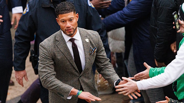Notre Dame head coach Marcus Freeman slaps hands with fans before a NCAA football game against Navy at Notre Dame Stadium on Saturday, Nov. 8, 2025, in South Bend.