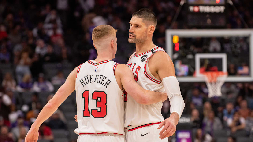 Mar 20, 2025; Sacramento, California, USA; Chicago Bulls guard Kevin Huerter (13) and center Nikola Vucevic (9) celebrate after defeating the Sacramento Kings at Golden 1 Center. Mandatory Credit: Ed Szczepanski-Imagn Images