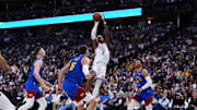 May 9, 2025; Denver, Colorado, USA; Denver Nuggets guard Christian Braun (0),center Nikola Jokic (15) and guard Russell Westbrook (4) watch as Oklahoma City Thunder guard Shai Gilgeous-Alexander (2) prepares to shoot the ball in the second quarter during game three of the second round for the 2025 NBA Playoffs at Ball Arena. Mandatory Credit: Ron Chenoy-Imagn Images