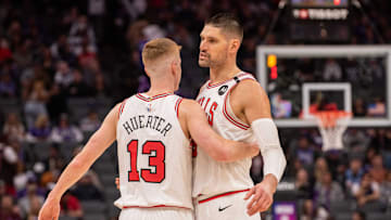 Mar 20, 2025; Sacramento, California, USA; Chicago Bulls guard Kevin Huerter (13) and center Nikola Vucevic (9) celebrate after defeating the Sacramento Kings at Golden 1 Center. Mandatory Credit: Ed Szczepanski-Imagn Images