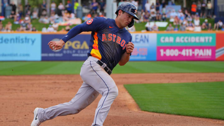 Mar 3, 2024; Port St. Lucie, Florida, USA; Houston Astros second baseman Shay Whitcomb (87) rounds third base and scores a run against the New York Mets in the second inning at Clover Park. Mandatory Credit: Jim Rassol-USA TODAY Sports