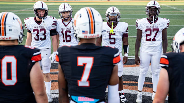 Dowling Catholic captains stand across from Valley captains during a high school football game between Valley and Dowling Catholic on Aug. 29, 2025, at Valley Stadium in West Des Moines, Iowa.