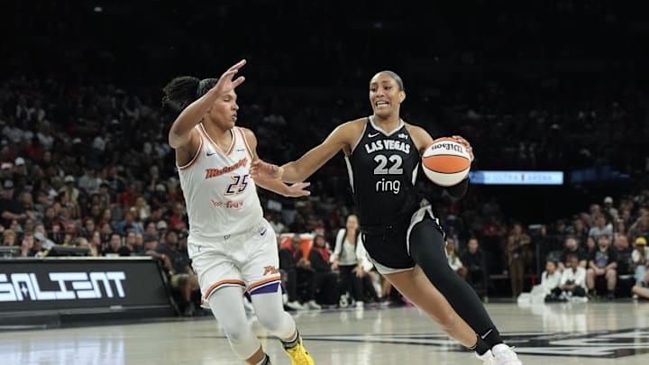 Aug 21, 2025; Las Vegas, Nevada, USA; Las Vegas Aces center A'ja Wilson (22) dribbles against Phoenix Mercury forward Alyssa Thomas (25) in the third quarter of their game at Michelob Ultra Arena. Mandatory Credit: Candice Ward-Imagn Images