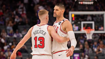 Mar 20, 2025; Sacramento, California, USA; Chicago Bulls guard Kevin Huerter (13) and center Nikola Vucevic (9) celebrate