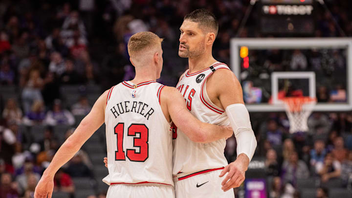 Mar 20, 2025; Sacramento, California, USA; Chicago Bulls guard Kevin Huerter (13) and center Nikola Vucevic (9) celebrate