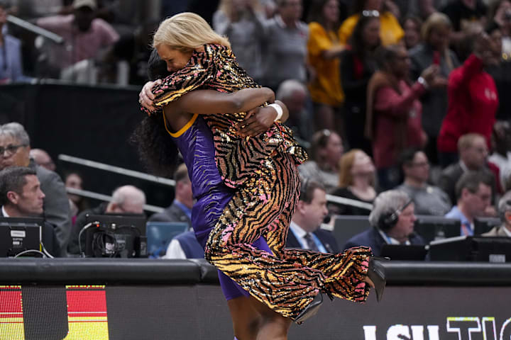 LSU star Flau'jae Johnson hugs head coach Kim Mulkey after defeating the Iowa Hawkeyes for the national championship. 