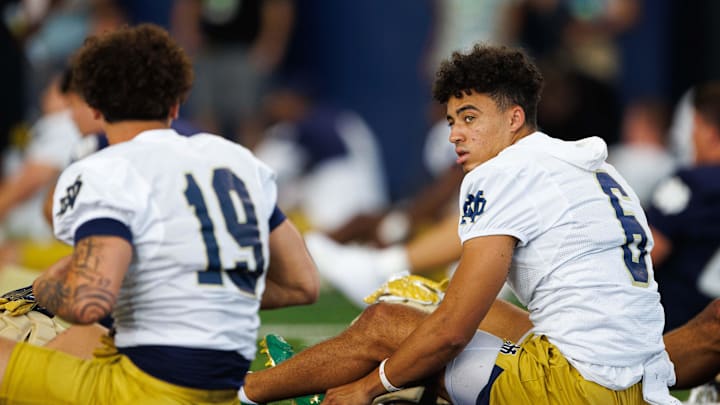 Notre Dame wide receivers Logan Saldate (19) and Jordan Faison (6) stretch before a Notre Dame football practice at Irish Athletic Center on Wednesday, July 31, 2024, in South Bend.