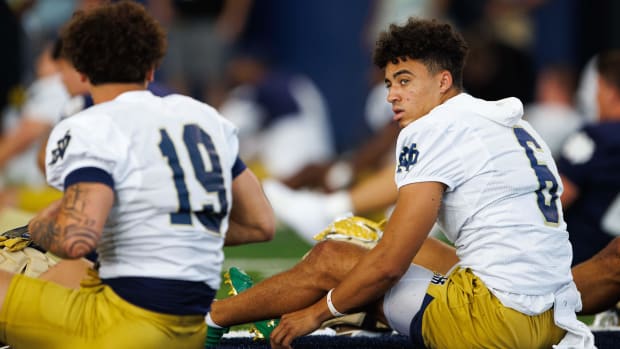 Jordan Faison stretches before the first practice of fall camp for Notre Dame in 2024