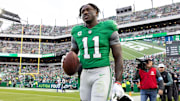 Dec 29, 2024; Philadelphia, Pennsylvania, USA; Philadelphia Eagles wide receiver A.J. Brown (11) carries his touchdown ball back to quarterback Tanner McKee (not pictured) during the third quarter against the Dallas Cowboys at Lincoln Financial Field. Mandatory Credit: Bill Streicher-Imagn Images