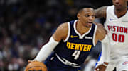 Dec 28, 2024; Denver, Colorado, USA; Denver Nuggets guard Russell Westbrook (4) drives past Detroit Pistons forward Ronald Holland II (00) in the second quarter at Ball Arena. Mandatory Credit: Ron Chenoy-Imagn Images