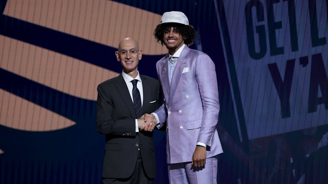 Asa Newell shaking NBA Commissioner Adam Silver's hand at the 2025 NBA Draft.
