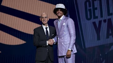 Asa Newell shaking NBA Commissioner Adam Silver's hand at the 2025 NBA Draft.