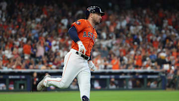 Oct 2, 2024; Houston, Texas, USA; Houston Astros third base Alex Bregman (2) runs after hitting a single against the Detroit Tigers during the second inning of game two of the Wildcard round for the 2024 MLB Playoffs at Minute Maid Park.