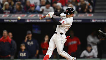 Oct 18, 2024; Cleveland, Ohio, USA; Cleveland Guardians outfielder Steven Kwan (38) hits a single in the third inning against the New York Yankees during game four of the ALCS for the 2024 MLB playoffs at Progressive Field. Mandatory Credit: Ken Blaze-Imagn Images