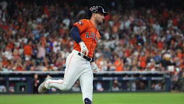 Oct 2, 2024; Houston, Texas, USA; Houston Astros third base Alex Bregman (2) runs after hitting a single against the Detroit Tigers during the second inning of game two of the Wildcard round for the 2024 MLB Playoffs at Minute Maid Park. Mandatory Credit: Thomas Shea-Imagn Images