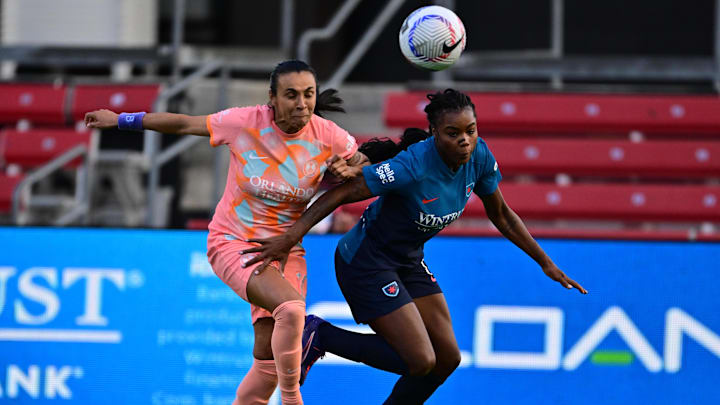 Orlando Pride forward Marta (10) battles Chicago Red Stars forward Ludmila (14) for control of a ball during the second half at SeatGeek Stadium 