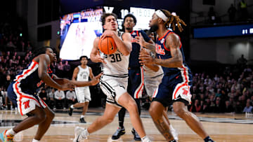 Feb 22, 2025; Nashville, Tennessee, USA; Vanderbilt Commodores guard Chris Manon (30) drives the lane against the Mississippi Rebels during the first half at Memorial Gymnasium. Mandatory Credit: Steve Roberts-Imagn Images