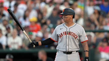 Rafael Devers bats against the Athletics.