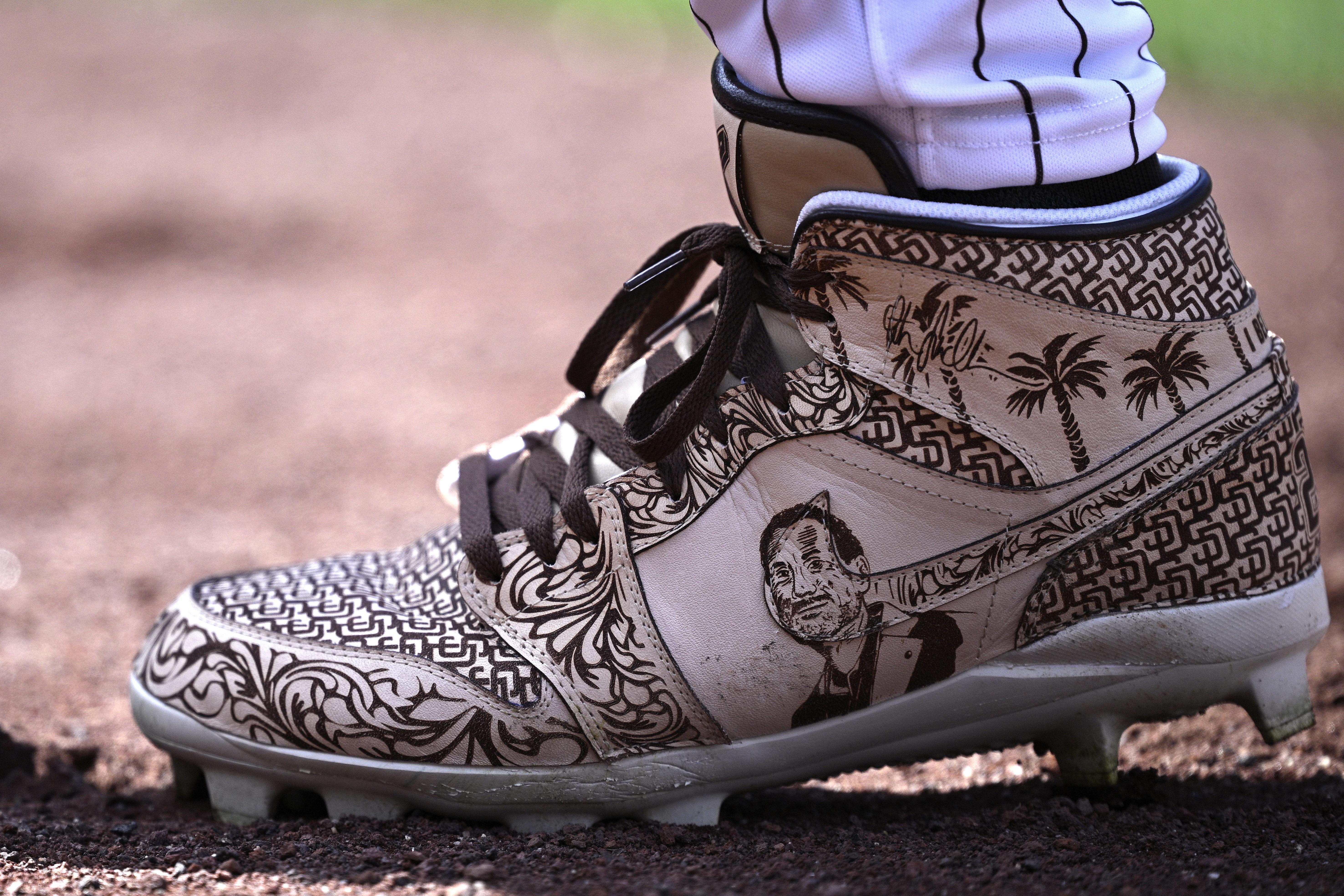 Side view of Fernando Tatis Jr,'s tan Air Jordan cleat.