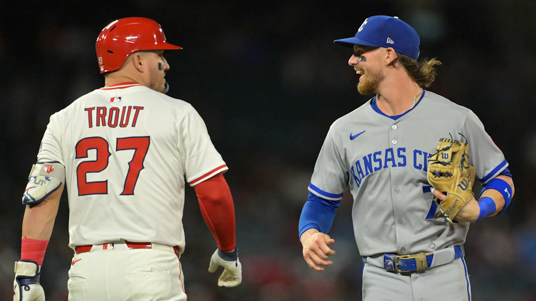 Sep 23, 2025; Anaheim, California, USA;  Los Angeles Angels designated hitter Mike Trout (27) and Kansas City Royals shortstop Bobby Witt Jr. (7) laugh as they pass each other after the fourth inning at Angel Stadium. Mandatory Credit: Jayne Kamin-Oncea-Imagn Images