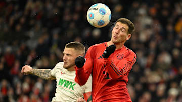 Leon Goretzka challenges for the ball against Ausgburg