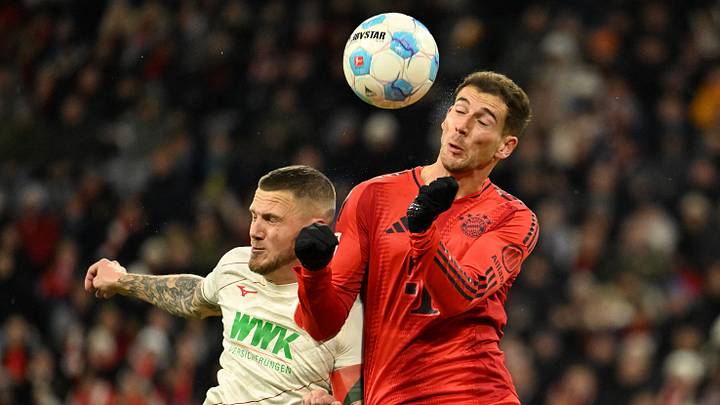 Leon Goretzka challenges for the ball against Ausgburg