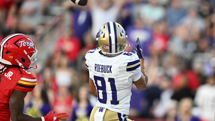 Oct 4, 2025; College Park, Maryland, USA;  Washington Huskies wide receiver Dezmen Roebuck (81) catches a touchdown pass in the second half against the Maryland Terrapins at SECU Stadium. Mandatory Credit: Jamie Sabau-Imagn Images