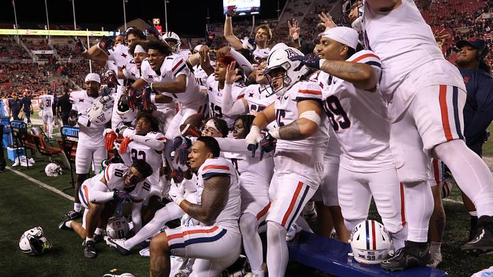 Sep 28, 2024; Salt Lake City, Utah, USA; The Arizona Wildcats celebrate a win over the Utah Utes at Rice-Eccles Stadium. Mandatory Credit: Rob Gray-Imagn Images