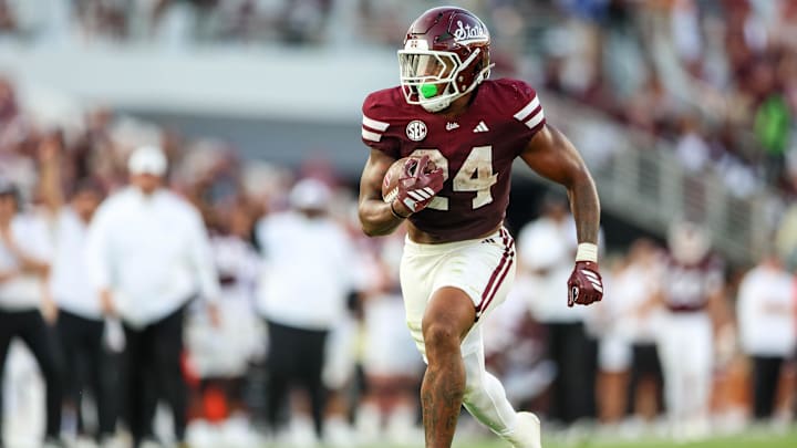 Sep 13, 2025; Starkville, Mississippi, USA; Mississippi State Bulldogs running back Fluff Bothwell (24) runs with the ball against the Alcorn State Braves during the second quarter at Davis Wade Stadium at Scott Field. Mandatory Credit: Wesley Hale-Imagn Images