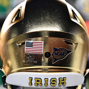 Aug 31, 2024; College Station, Texas, USA; A detailed view of Notre Dame Fighting Irish helmet on the sideline during the game against the Texas A&M Aggies at Kyle Field. Mandatory Credit: Maria Lysaker-Imagn Images