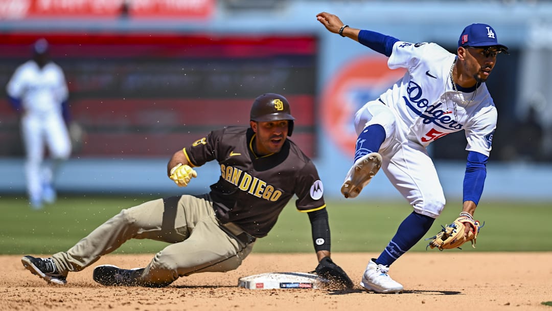 San Diego Padres outfielder Ramón Laureano slides into second base against Los Angeles Dodgers shortstop Mookie Betts.