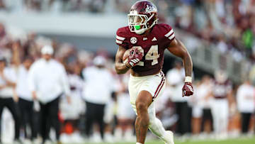Sep 13, 2025; Starkville, Mississippi, USA; Mississippi State Bulldogs running back Fluff Bothwell (24) runs with the ball against the Alcorn State Braves during the second quarter at Davis Wade Stadium at Scott Field. Mandatory Credit: Wesley Hale-Imagn Images