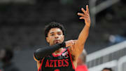 Dec 21, 2024; San Jose, California, USA; San Diego State Aztecs guard Nick Boyd (2) gestures after making a three point basket against the California Golden Bears during the second half at SAP Center. Mandatory Credit: Darren Yamashita-Imagn Images