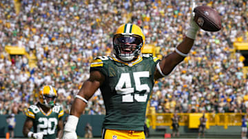 Sep 15, 2024; Green Bay, Wisconsin, USA;  Green Bay Packers linebacker Eric Wilson (45) celebrates following an interception during the fourth quarter against the Indianapolis Colts at Lambeau Field. Mandatory Credit: Jeff Hanisch-Imagn Images