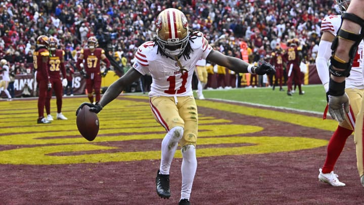 San Francisco 49ers wide receiver Brandon Aiyuk celebrates after scoring a touchdown against the Washington Commanders during the second half at FedExField.