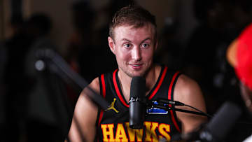 Hawks guard Luke Kennard talks to reporters at media day. 