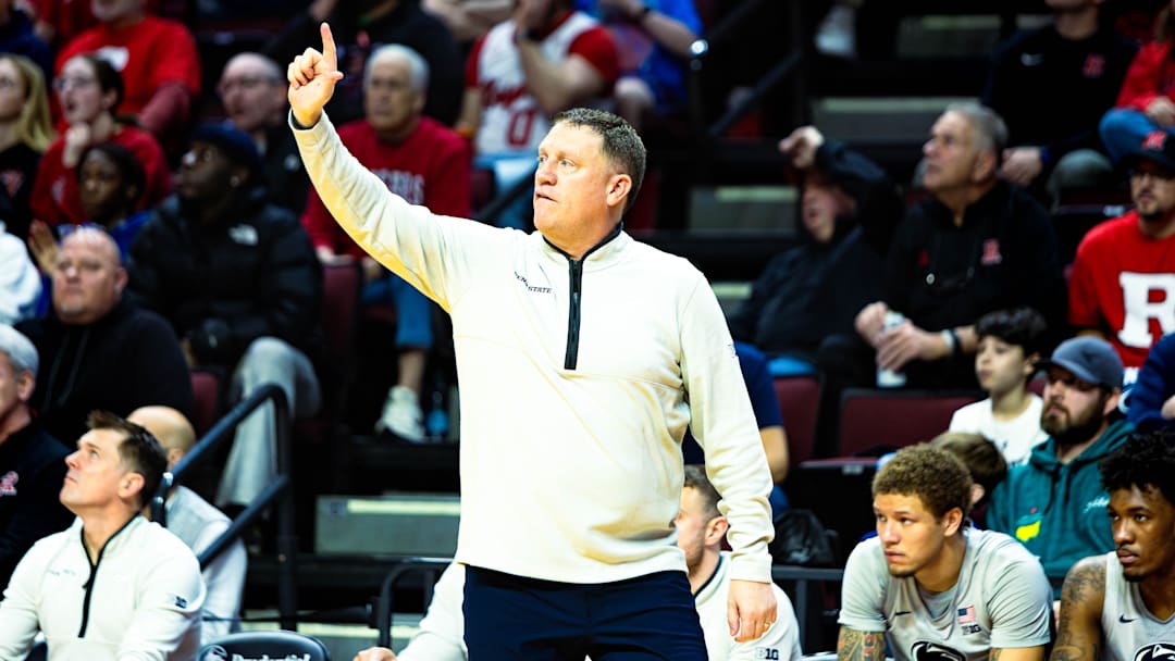 Penn State Nittany Lions men's basketball coach Mike Rhoades calls out a play to his team during the game against Rutgers. 