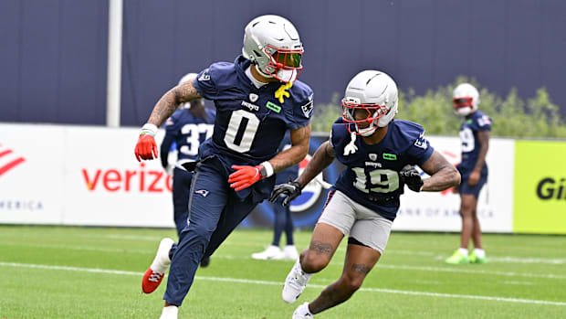 Jun 9, 2025; Foxborough, MA, USA; New England Patriots cornerback Christian Gonzalez (0) and cornerback Kobee Minor (19) run