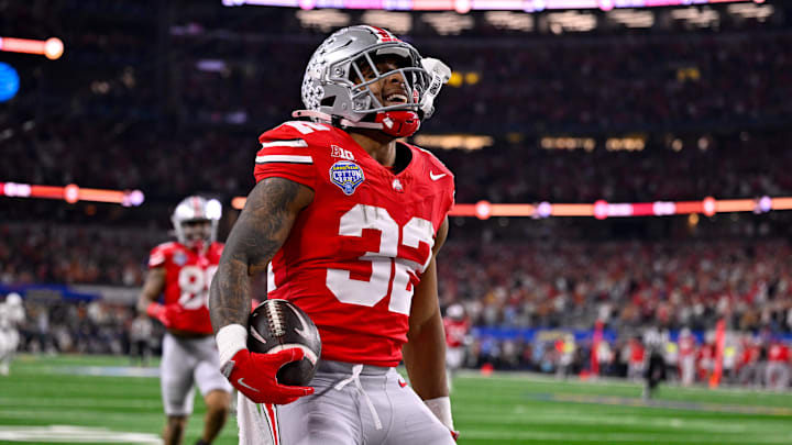 Jan 10, 2025; Arlington, TX, USA; Ohio State Buckeyes running back TreVeyon Henderson (32) celebrates during the game between the Texas Longhorns and the Ohio State Buckeyes at AT&T Stadium. Jan 10, 2025; Arlington, TX, USA; Ohio State Buckeyes running back TreVeyon Henderson (32) celebrates during the game between the Texas Longhorns and the Ohio State Buckeyes at AT&T Stadium.
