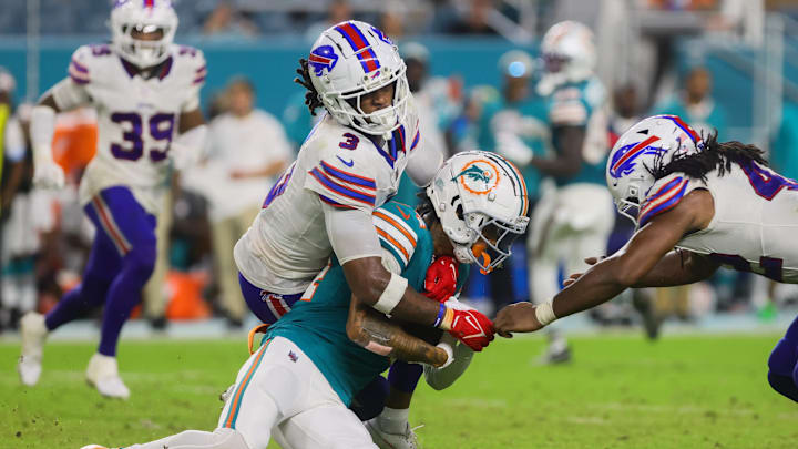 Sep 12, 2024; Miami Gardens, Florida, USA; Miami Dolphins wide receiver Robbie Chosen (84) runs with the football against Buffalo Bills safety Damar Hamlin (3) during the fourth quarter at Hard Rock Stadium. Mandatory Credit: Sam Navarro-Imagn Images