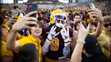 Nov 23, 2024; Tempe, Arizona, USA; Arizona State Sun Devils wide receiver Troy Omeire (9) celebrates with fans on the field against the Brigham Young Cougars in the second half at Mountain America Stadium. Mandatory Credit: Mark J. Rebilas-Imagn Images