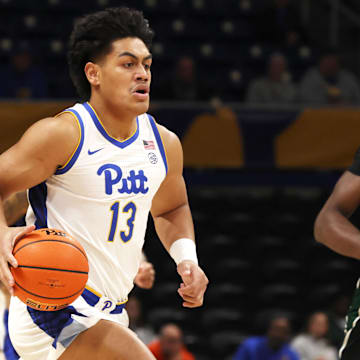 Nov 10, 2025; Pittsburgh, Pennsylvania, USA;  Pittsburgh Panthers forward Roman Siulepa (13) brings the ball up court on a fast break against the Eastern Michigan Eagles during the first half at Petersen Events Center. Mandatory Credit: Charles LeClaire-Imagn Images