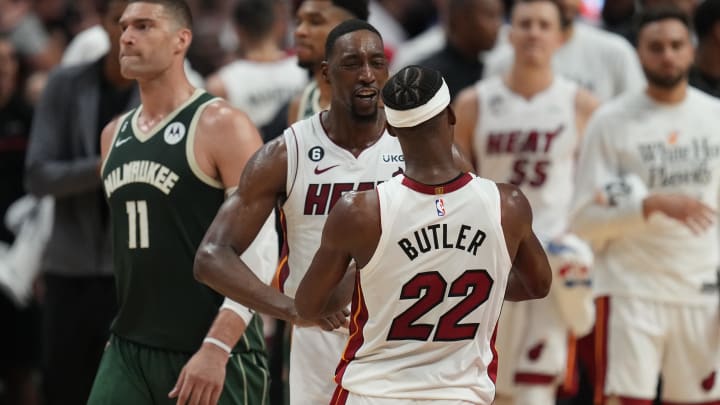 Apr 24, 2023; Miami, Florida, USA; Miami Heat forward Jimmy Butler (22) celebrates with center Bam Adebayo (13) following a victory over the Milwaukee Bucks in game four of the 2023 NBA Playoffs at Kaseya Center. Mandatory Credit: Jim Rassol-USA TODAY Sports