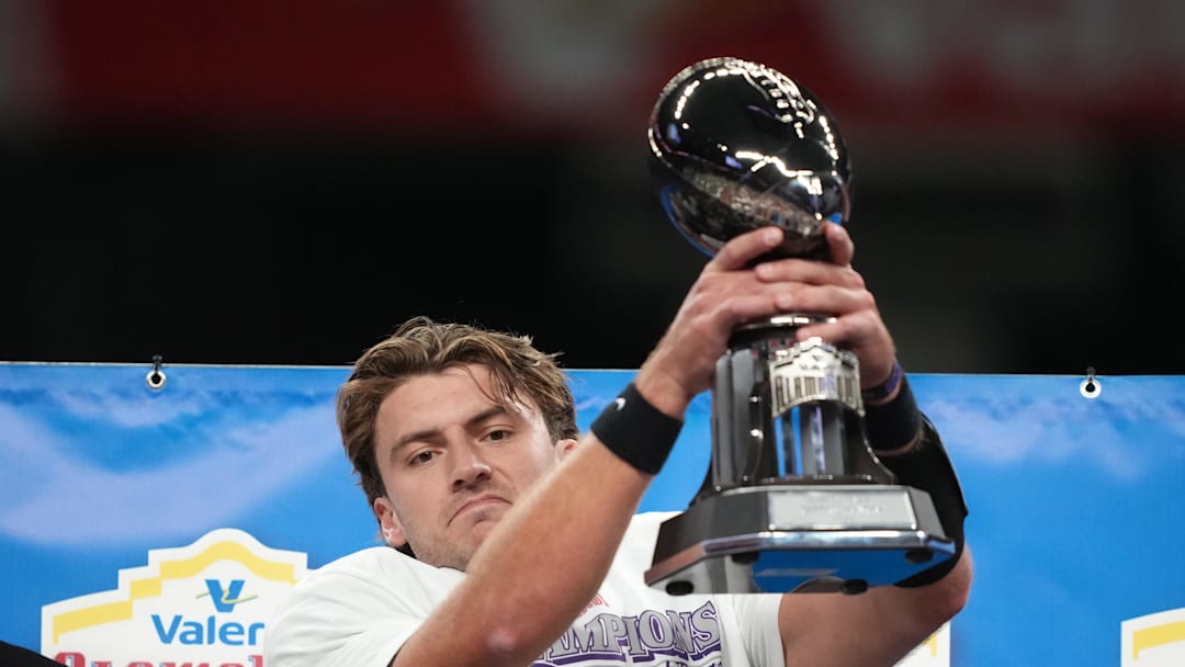 Dec 30, 2025; San Antonio, TX, USA; TCU Horned Frogs quarterback Ken Seals holds the Alamo Bowl most valuable offensive player trophy after victory over the Southern California Trojans at Alamodome. Mandatory Credit: Kirby Lee-Imagn Images