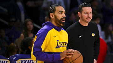 Mar 20, 2025; Los Angeles, California, USA; Los Angeles Lakers guard Gabe Vincent (7) talks with Los Angeles Lakers head coach JJ Redick before the game against the Milwaukee Bucksat Crypto.com Arena. Mandatory Credit: Jonathan Hui-Imagn Images
