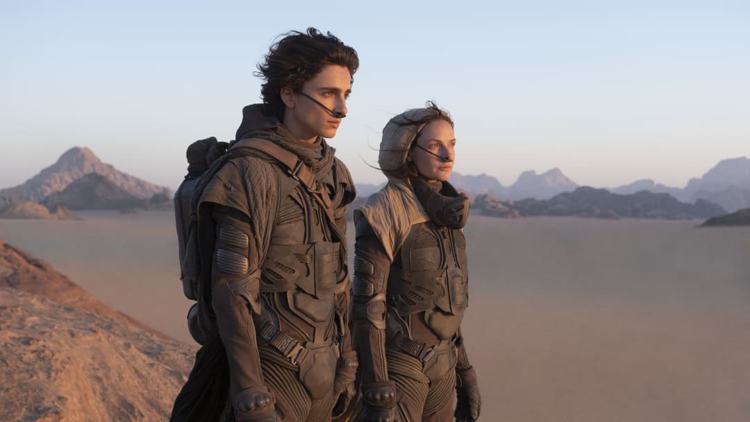 (L-r) TIMOTHÉE CHALAMET as Paul Atreides and REBECCA FERGUSON as Lady Jessica Atreides in Warner Bros. Pictures and Legendary Pictures’ action adventure “DUNE,” a Warner Bros. Pictures release. Courtesy of Warner Bros. Pictures and Legendary Pictures, Chiabella James